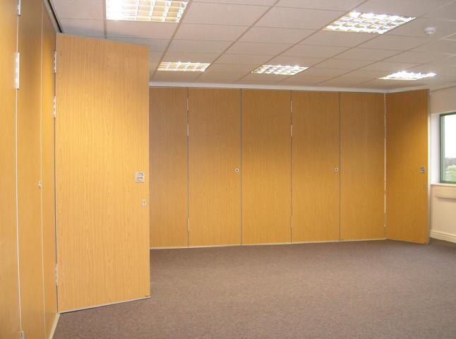 Multifold sliding folding partition Type M80 showing full height pass door
