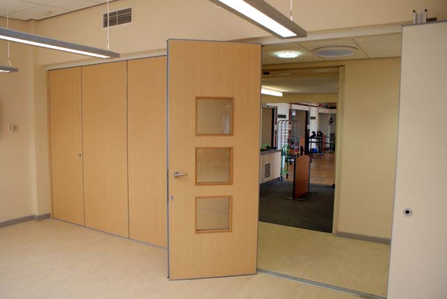 Multifold sliding folding partition M80 with passdoor with vision panels