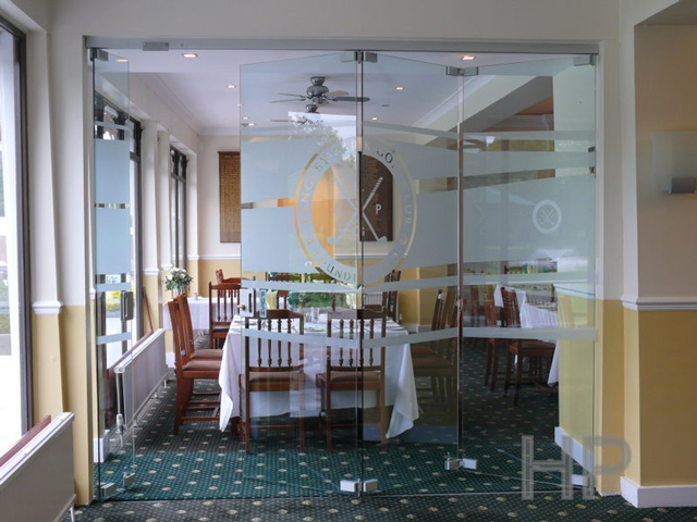 Glazed frameless folding partition open