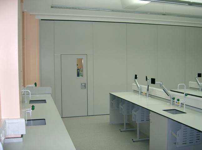 Acoustic movable wall Type 110C with inset pass door and vision panel